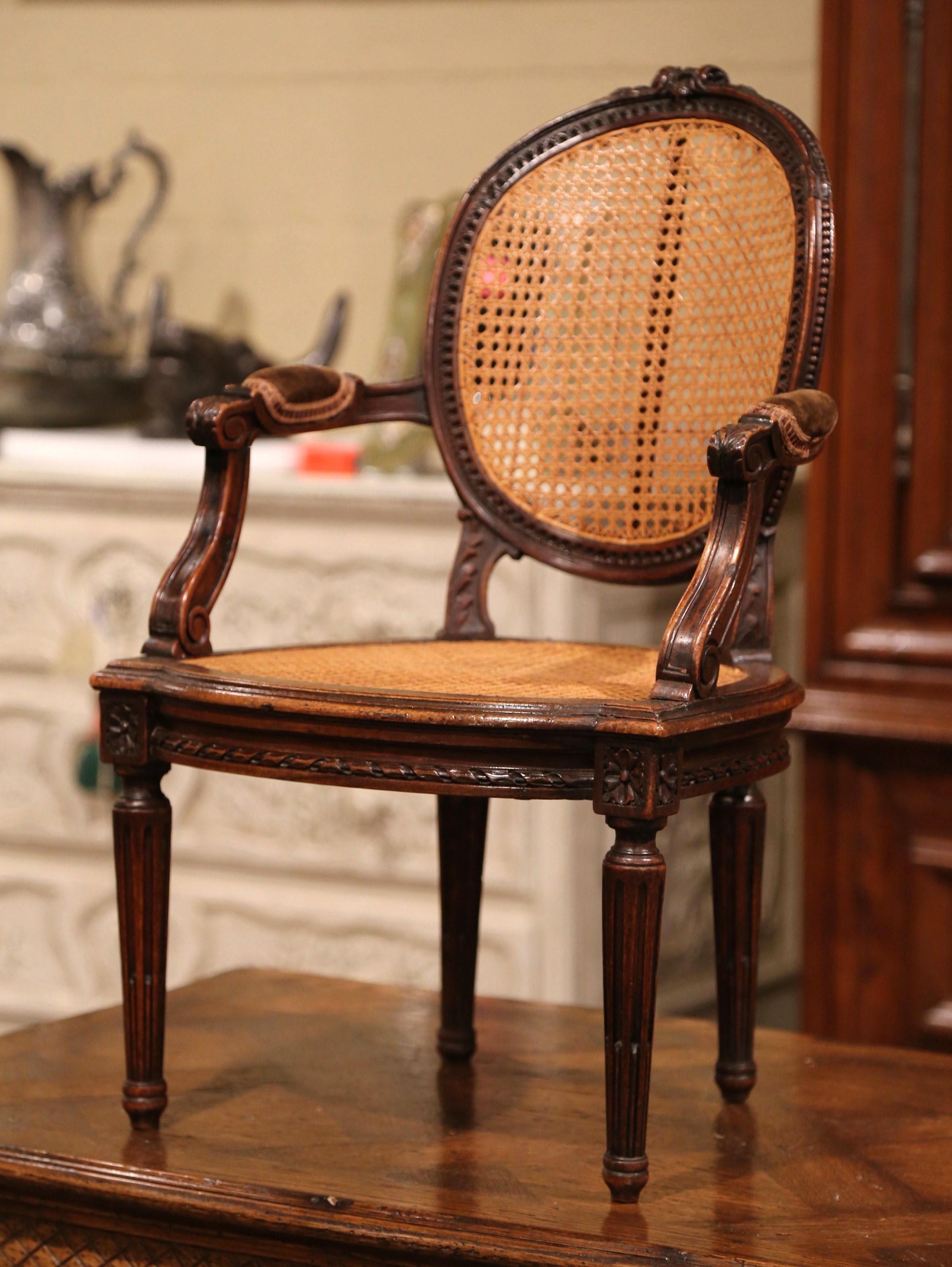 Hand-Carved 19th Century French Louis XVI Carved Walnut and Cane Child Armchair