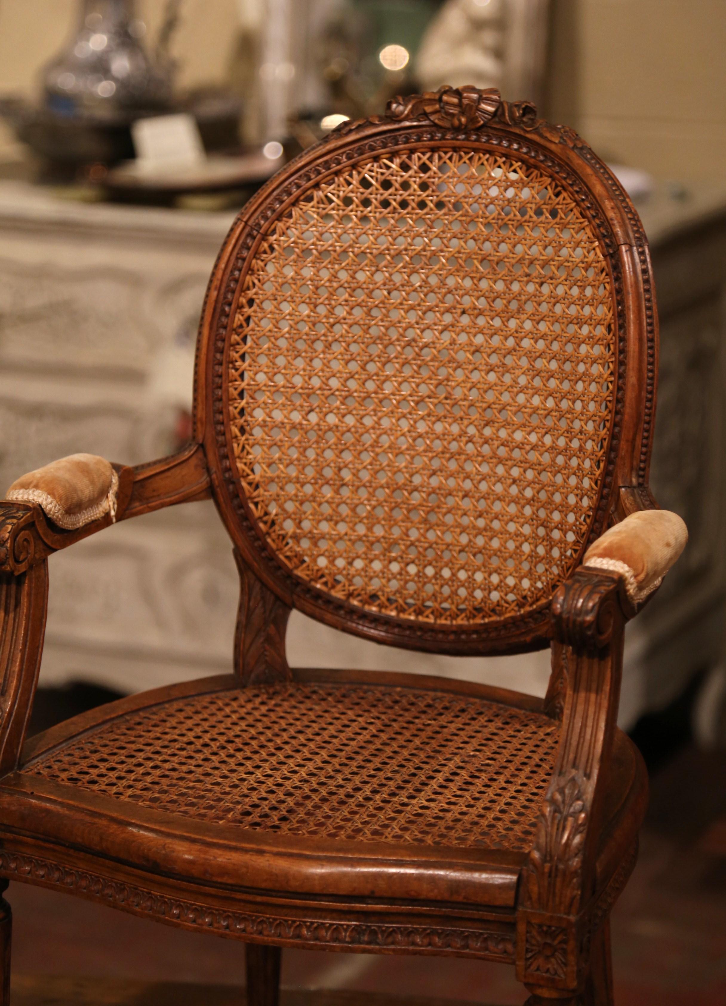 Hand-Carved 19th Century French Louis XVI Carved Walnut and Cane Child Armchair