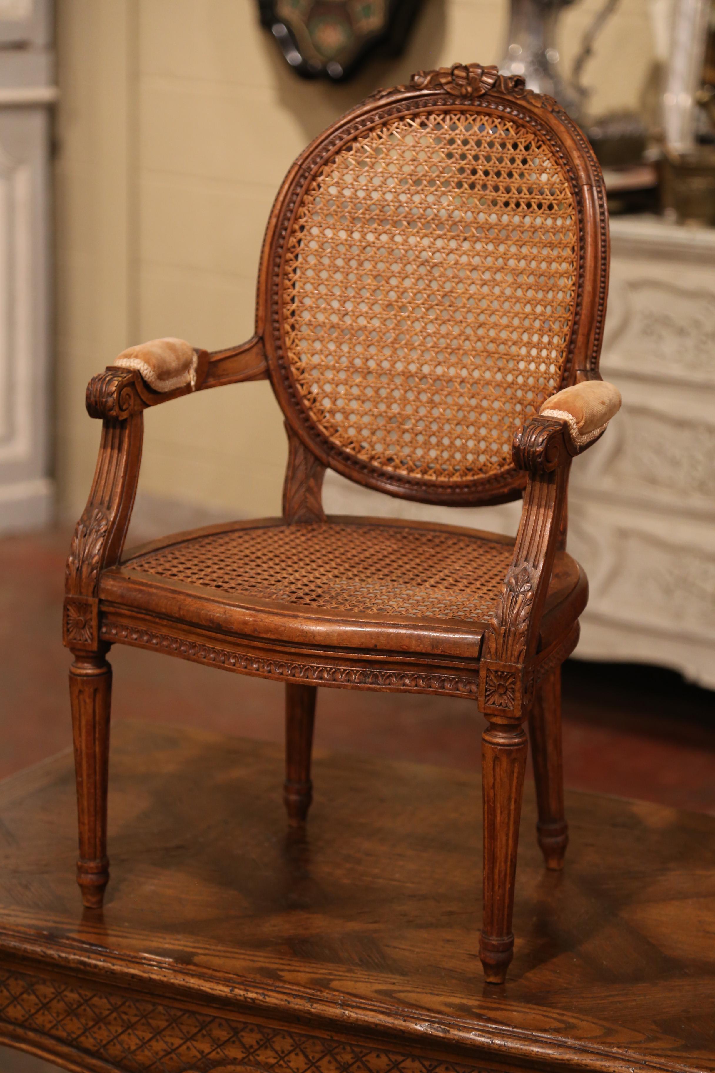 19th Century French Louis XVI Carved Walnut and Cane Child Armchair In Excellent Condition In Dallas, TX