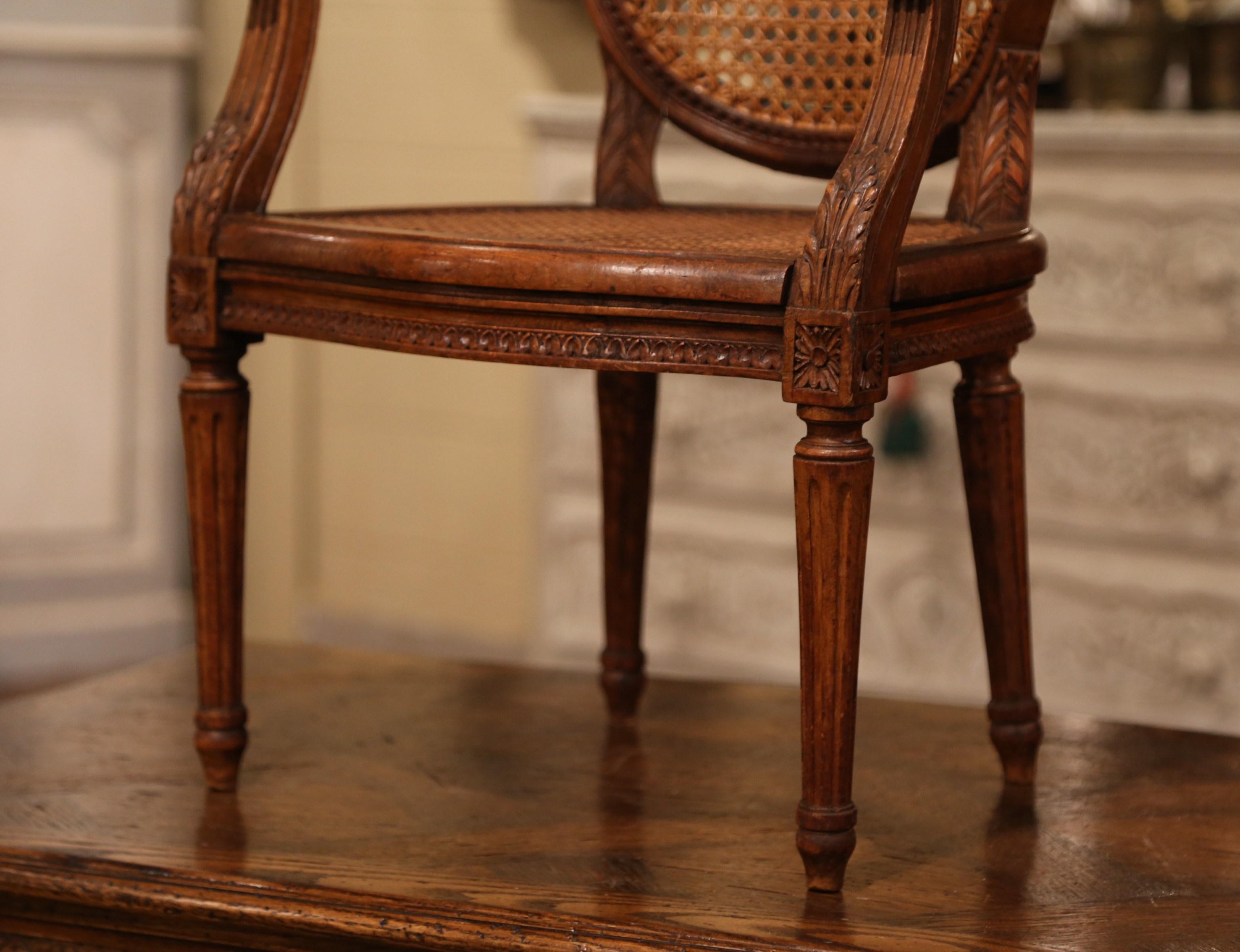 19th Century French Louis XVI Carved Walnut and Cane Child Armchair 1