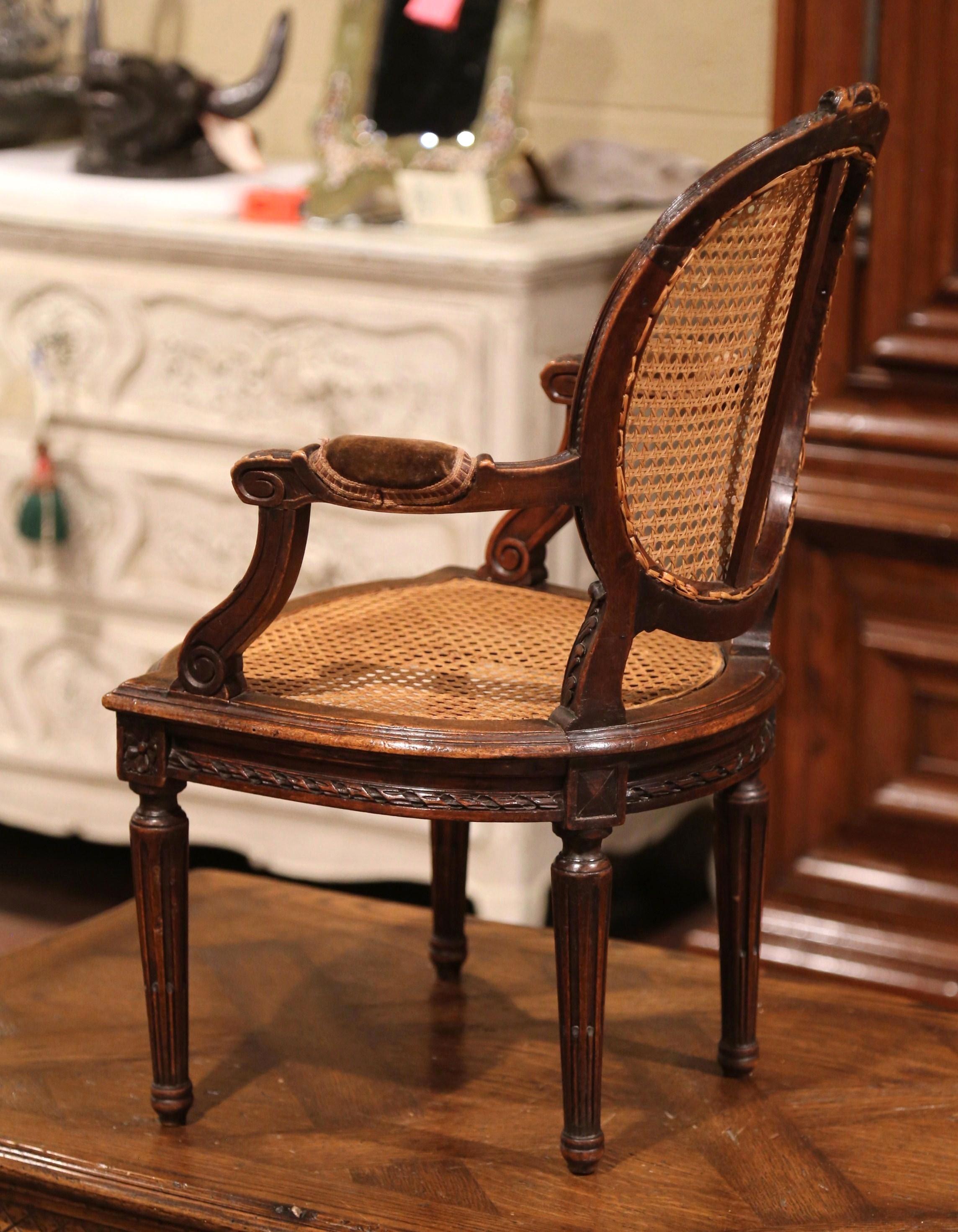 19th Century French Louis XVI Carved Walnut and Cane Child Armchair 4