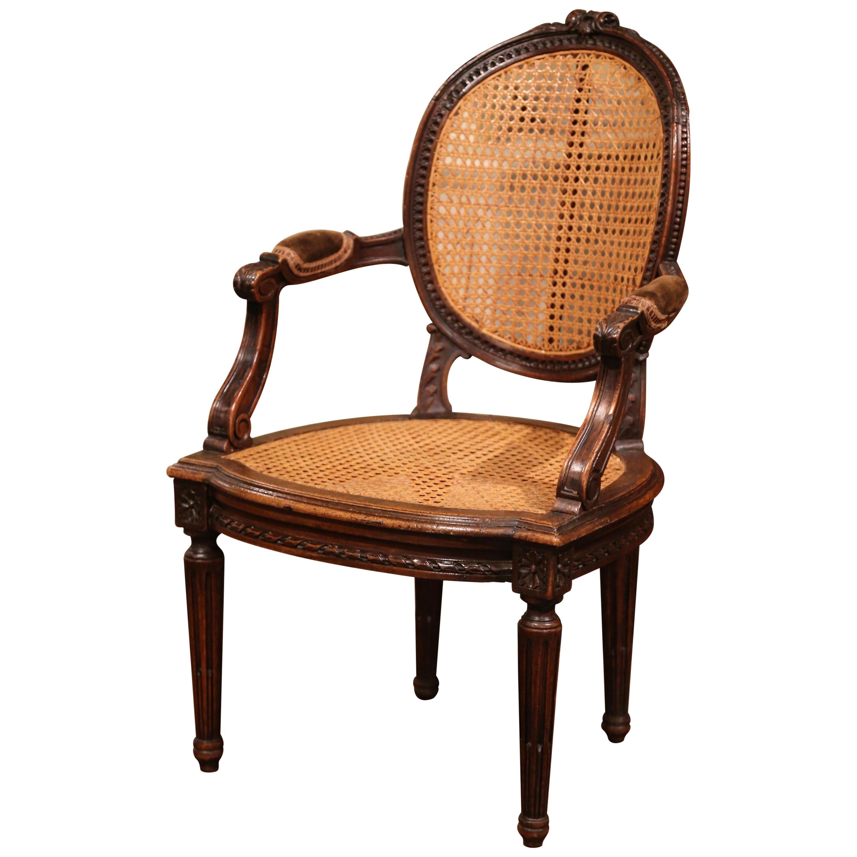 19th Century French Louis XVI Carved Walnut and Cane Child Armchair