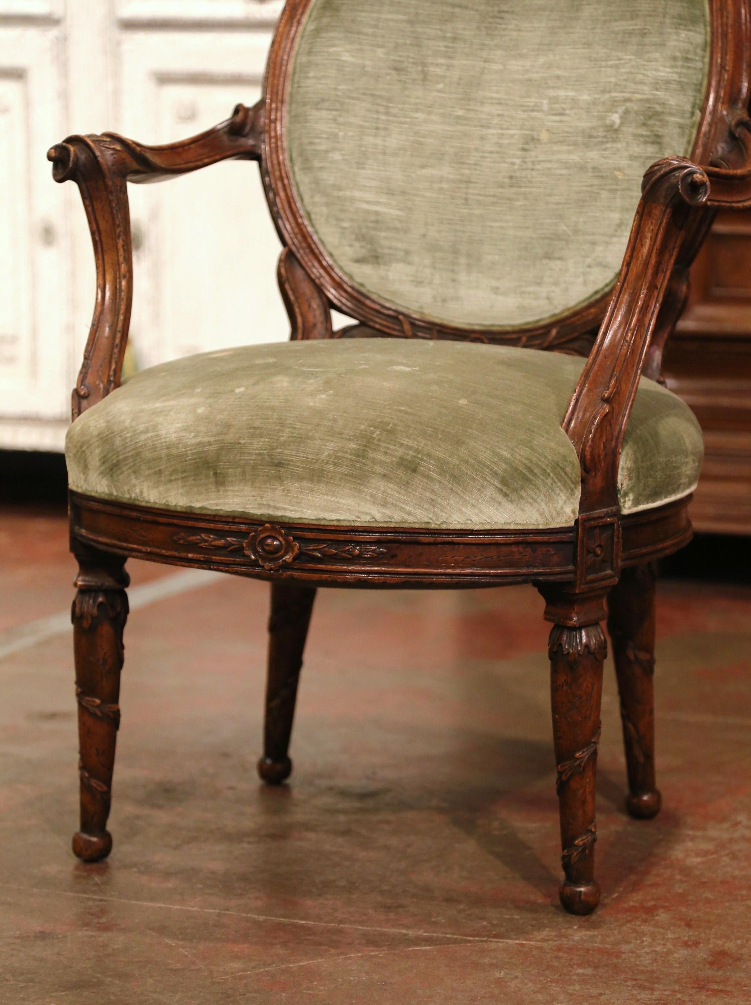 Hand-Carved 19th Century French Louis XVI Carved Walnut and Velvet Bergere Armchair