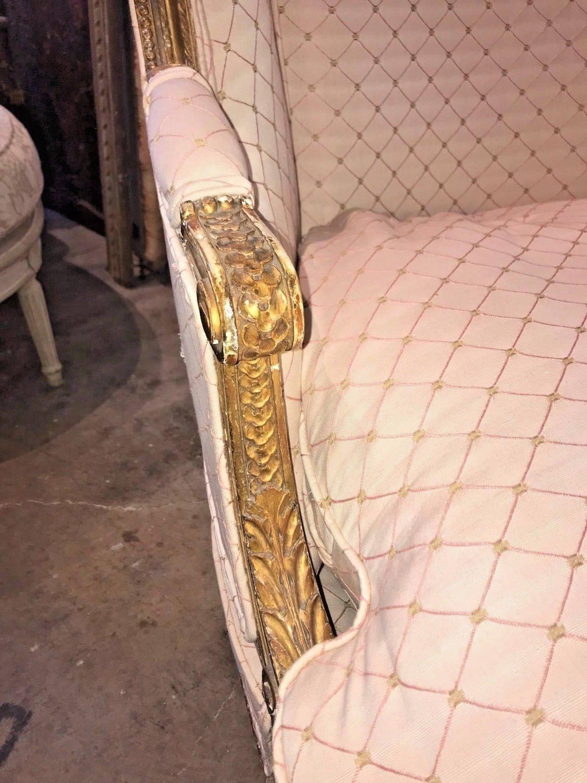 Gracefully designed antique French Louis XVI style carved wood and gold gilded chaise longue recently upholstered in a down-filled fabric. The entire supported by Classic Louis XVI style tapered and fluted legs,

circa 1880.

Good condition.