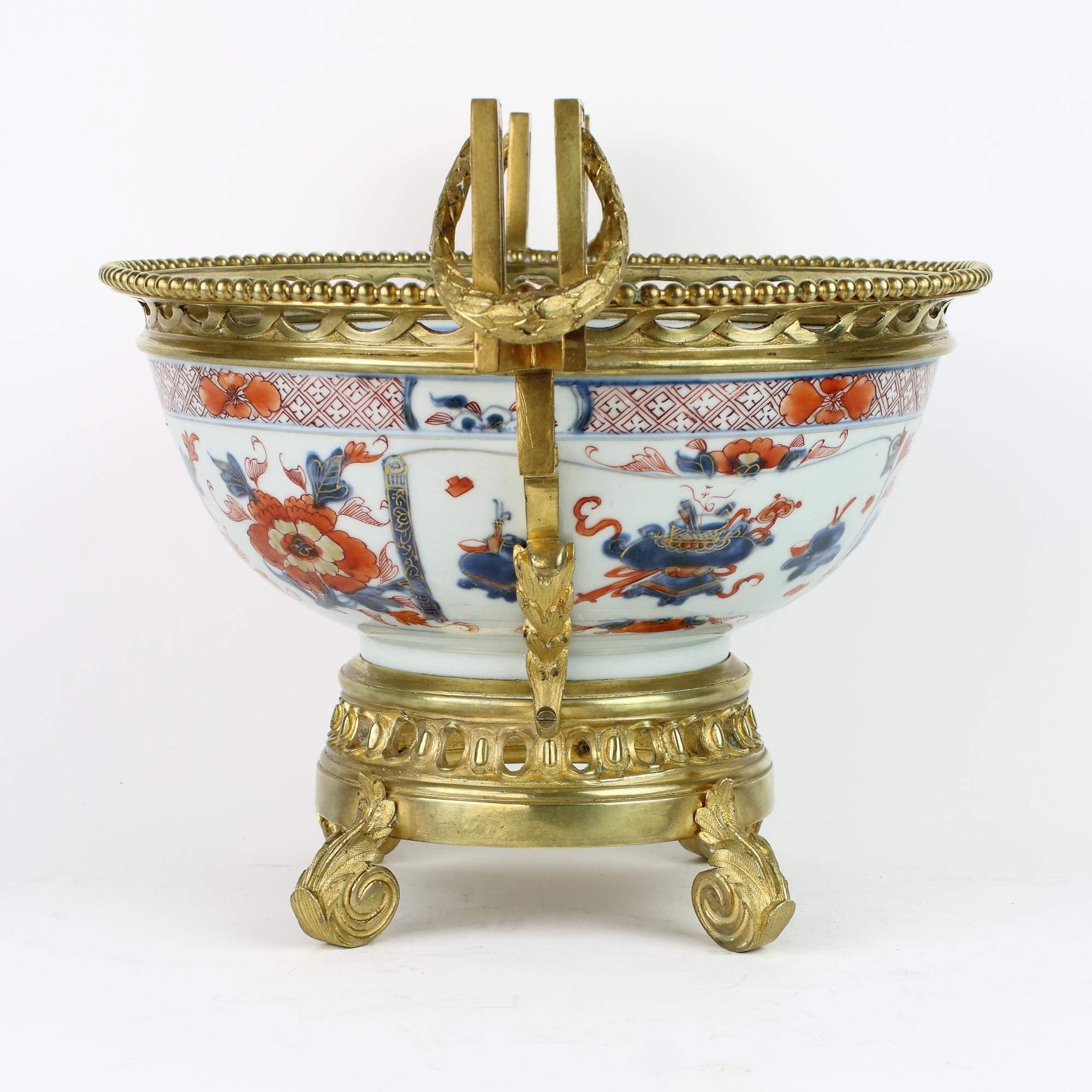 Excellent 19th century French Louis XVI decorative Imari Porcelain gilt bronze mount bowl

A 19th century Chinese blue and red Imari ware bowl mounted on a round Louis XVI style openwork base with four neoclassical scroll feet, the Imari bowl