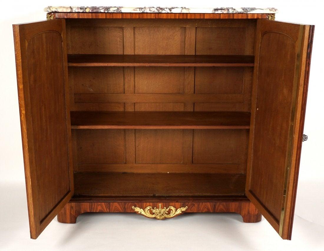 Beautiful 19th century French rosewood cabinet with gilt bronze mounts. Beautiful red chinoiserie design cabinet doors and a breche Violette marble top. Signed Paul Sormani.