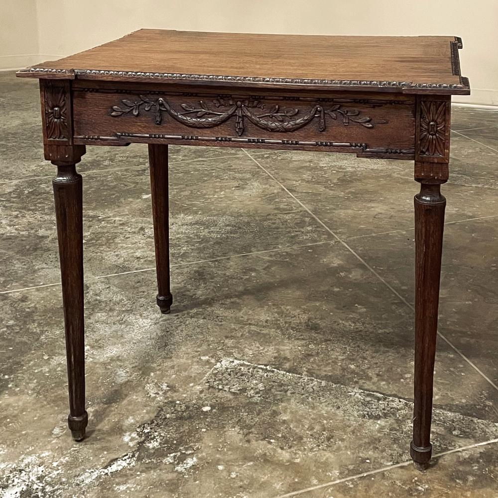 19th century French Louis XVI end table was hand-crafted during the early years of the 1800s, and features solid old-growth oak construction to literally last for generations! The top is contoured to accentuate the cornerposts, and hand-carved with