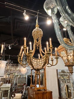 Lampadario francese Luigi XVI del XIX secolo in bronzo dorato e cristallo