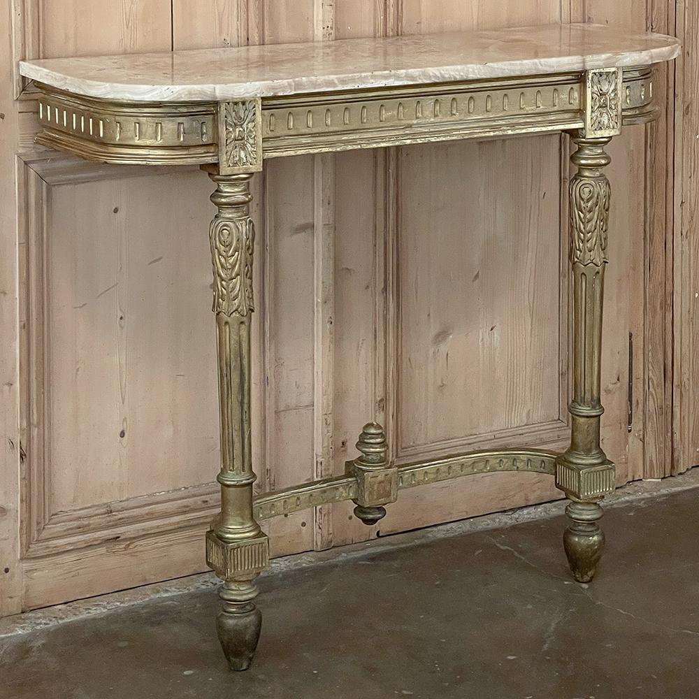 19th century French Louis XVI giltwood marble top console represents a balance between the ornate and the austere, with clear classical expression in architecture and subtle decorative accents making it ideal for a wide variety of decors. Topped