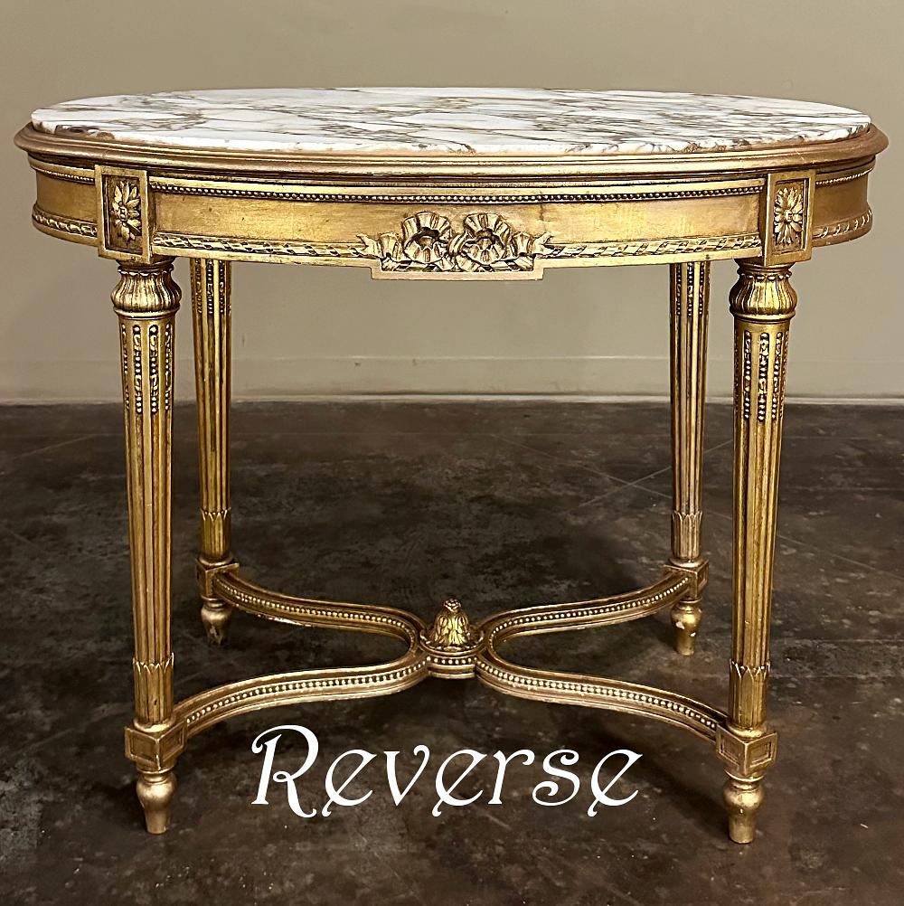 19th Century French Louis XVI Giltwood Marble Top Oval End Table is a definitive study in the neoclassical style that was so enamored by the King!  The elegant oval shape means no sharp corners at all, with the luxuriously veined marble top framed
