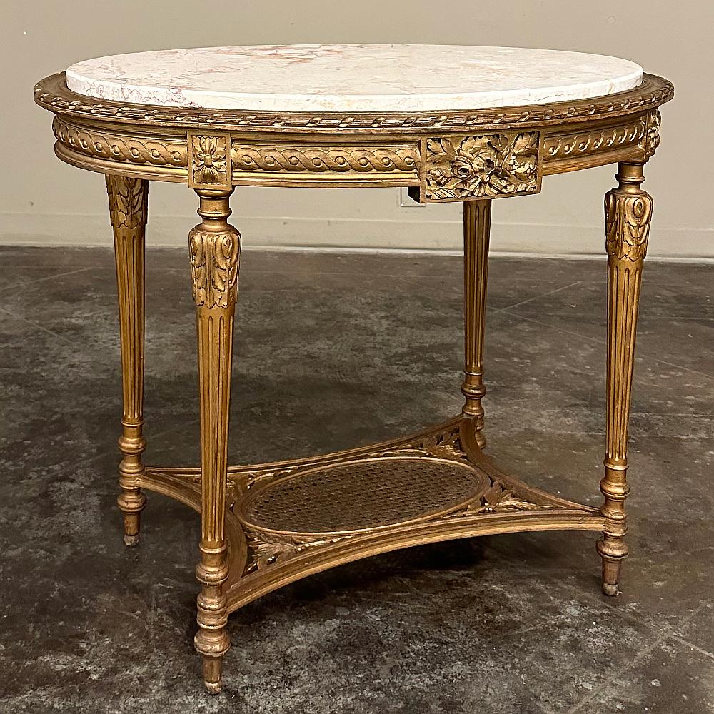 19th Century French Louis XVI Giltwood Marble Top Oval End Table is the ideal choice for a classic, timeless touch of style!  A great selection as a center table in a cozy foyer, as well, it features a tailored architecture that is enhanced with