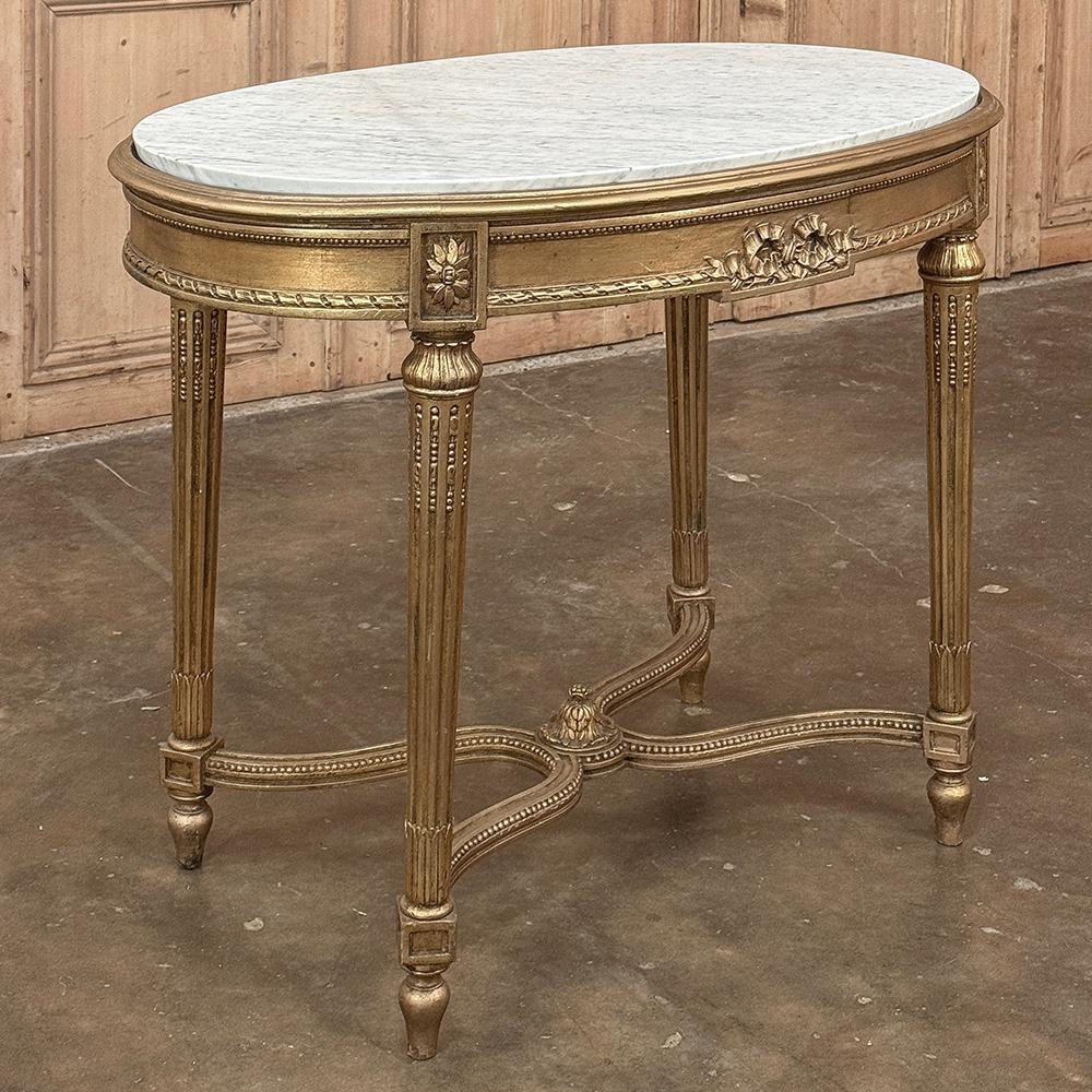 19th Century French Louis XVI Giltwood Marble Top Oval End Table is a definitive study in the neoclassical style that was so enamored by the King!  The elegant oval shape means no sharp corners at all, with the luxurious Carrara marble top framed by