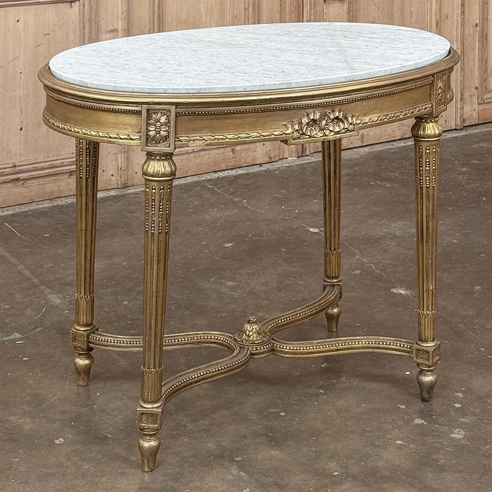 Intagliato a mano 19th Century French Louis XVI Giltwood Marble Top Oval End Table in vendita