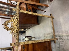 19th Century French Louis XVI Giltwood Mirror with Torch and Quiver Crest