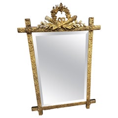 19th Century French Louis XVI Giltwood Mirror with Torch and Quiver Crest