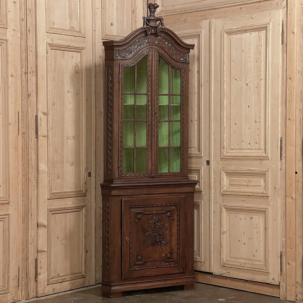 19th Century French Louis XVI Hand-Carved Corner Cabinet is a splendid example of craftsmanship resulting in a design that takes advantage of otherwise dead space in the room, and turns it into a showcase!  The classic lines of this heirloom revolve