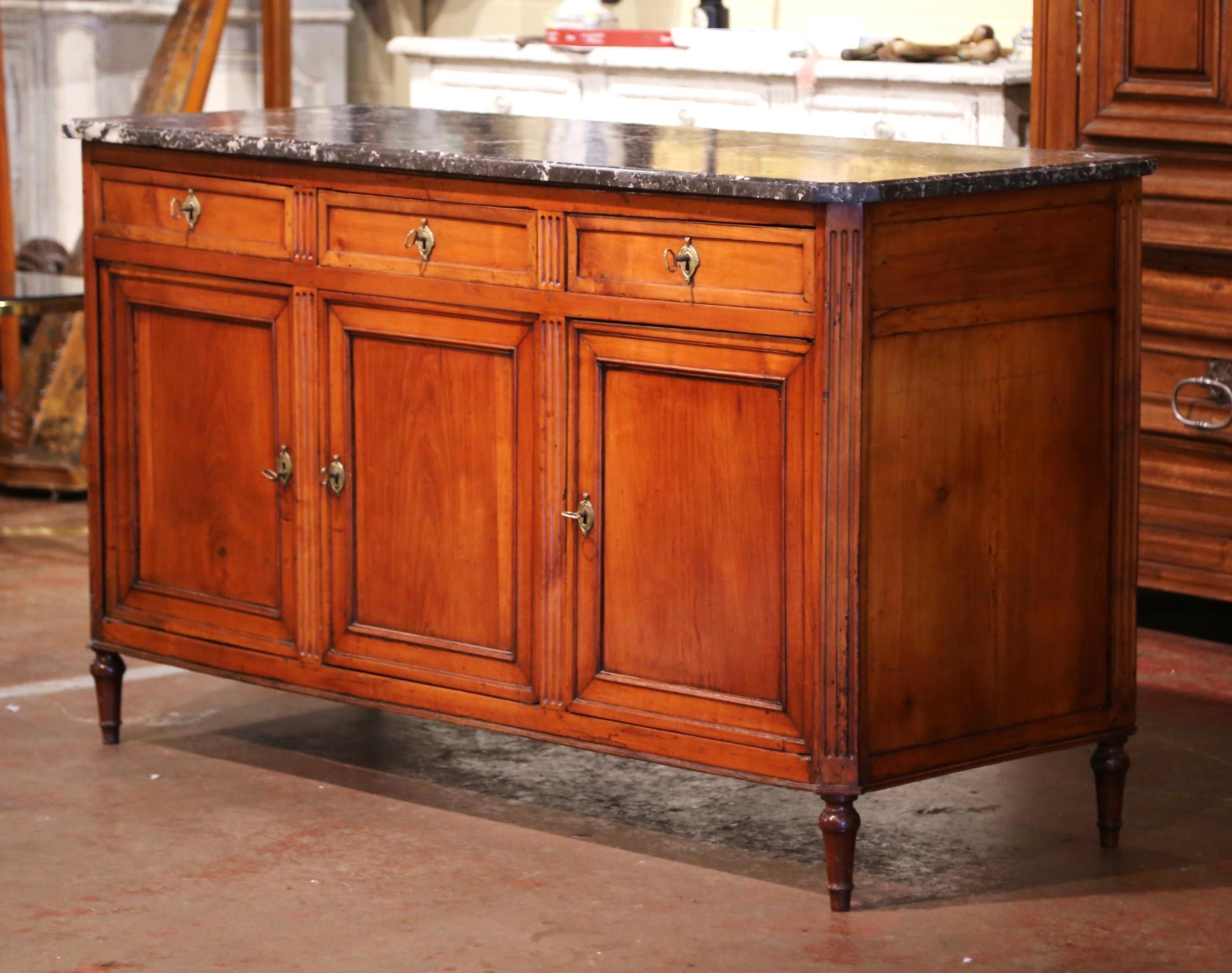 Use this antique enfilade as a serving piece in a dining room. Crafted in Paris, France, circa 1880, this elegant buffet stands on six tapered legs over a straight apron. The cabinet with spine columns at both ends and between each door, features