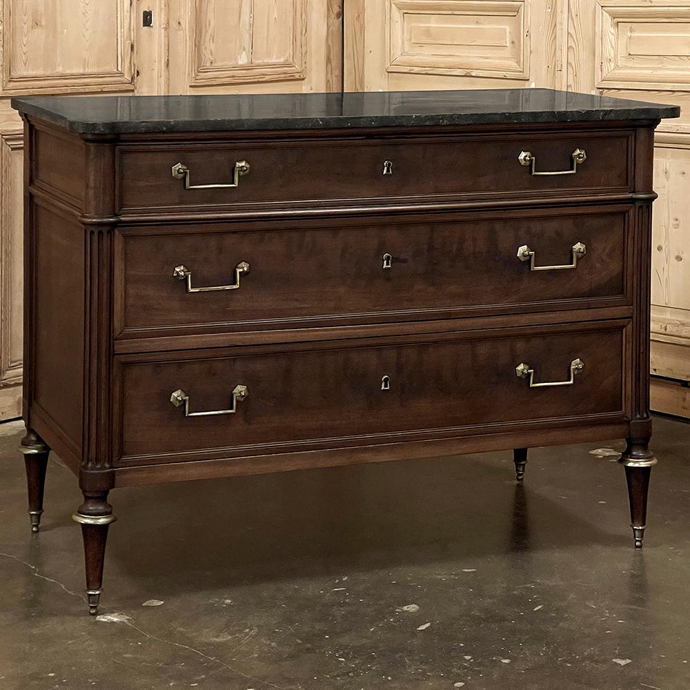 19th Century French Louis XVI Mahogany Commode With Marble Top is truly a classic!  Inspired by the architecture of the ancient Greeks and Romans, this piece was crafted from fine imported mahogany, and features three full width drawers combined