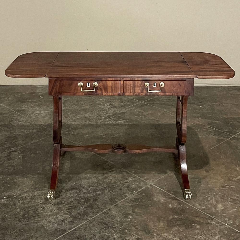 19th century French Louis XVI Mahogany drop leaf end table is elegant, versatile, and crafted to last for generations! Utilizing exotic imported mahogany, the artisans created a rectangular surface with two drop leaves, both of which have generously