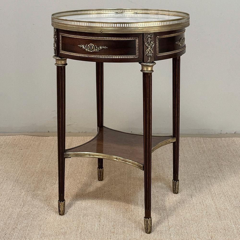 19th Century French Louis XVI Mahogany Marble Top Gueridon ~ Round End Table was crafted by master artisans during the Belle Epoque, and features jewelry-quality bronze castings as adornment around the entire perimeter.  Lovingly crafted from exotic