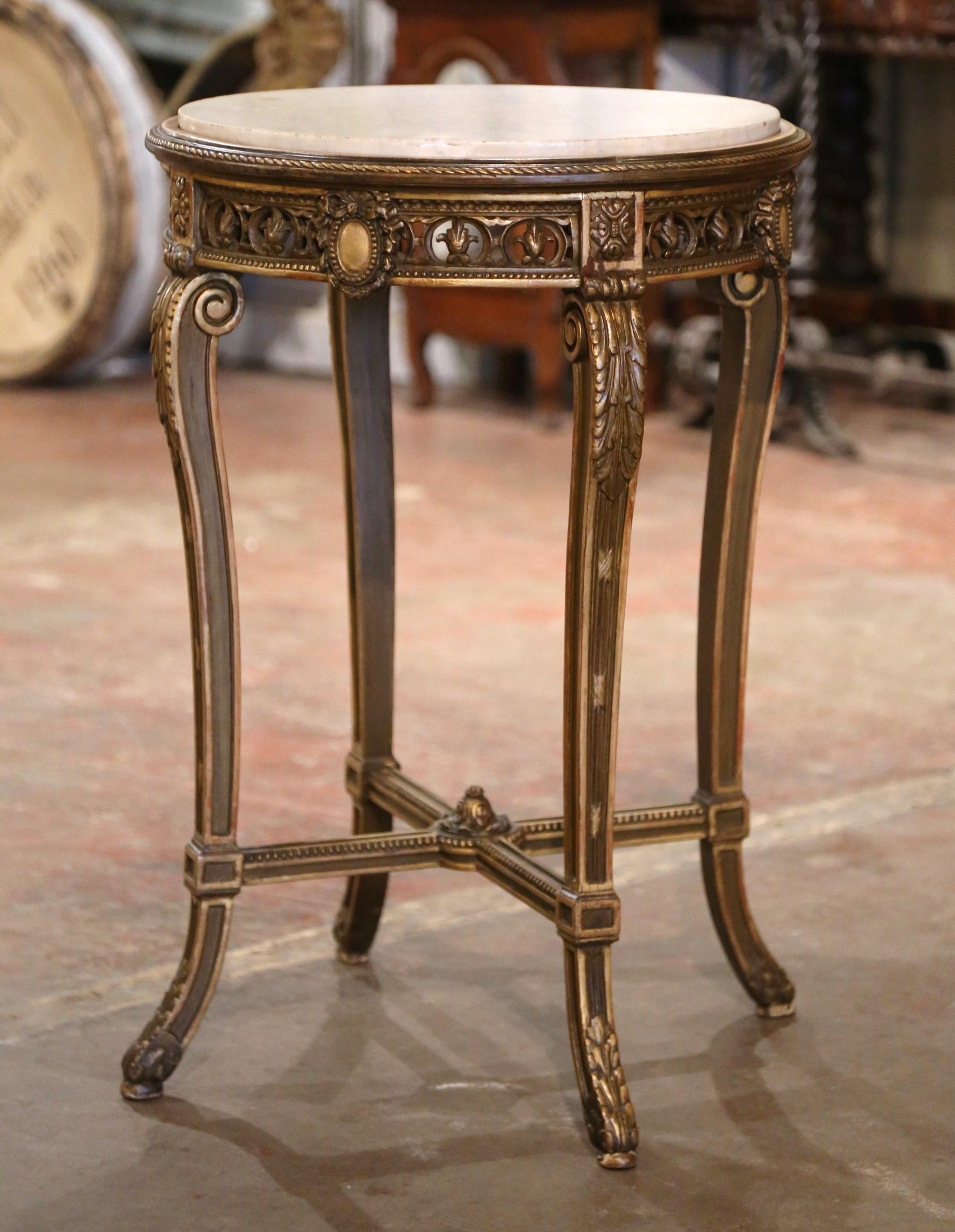  Decorate a den with this elegant antique side table. Crafted in France circa 1880, and round in shape, the table sits on cabriole legs decorated with acanthus leaf motifs at the shoulders and ending with leaf decor over the feet. The table features