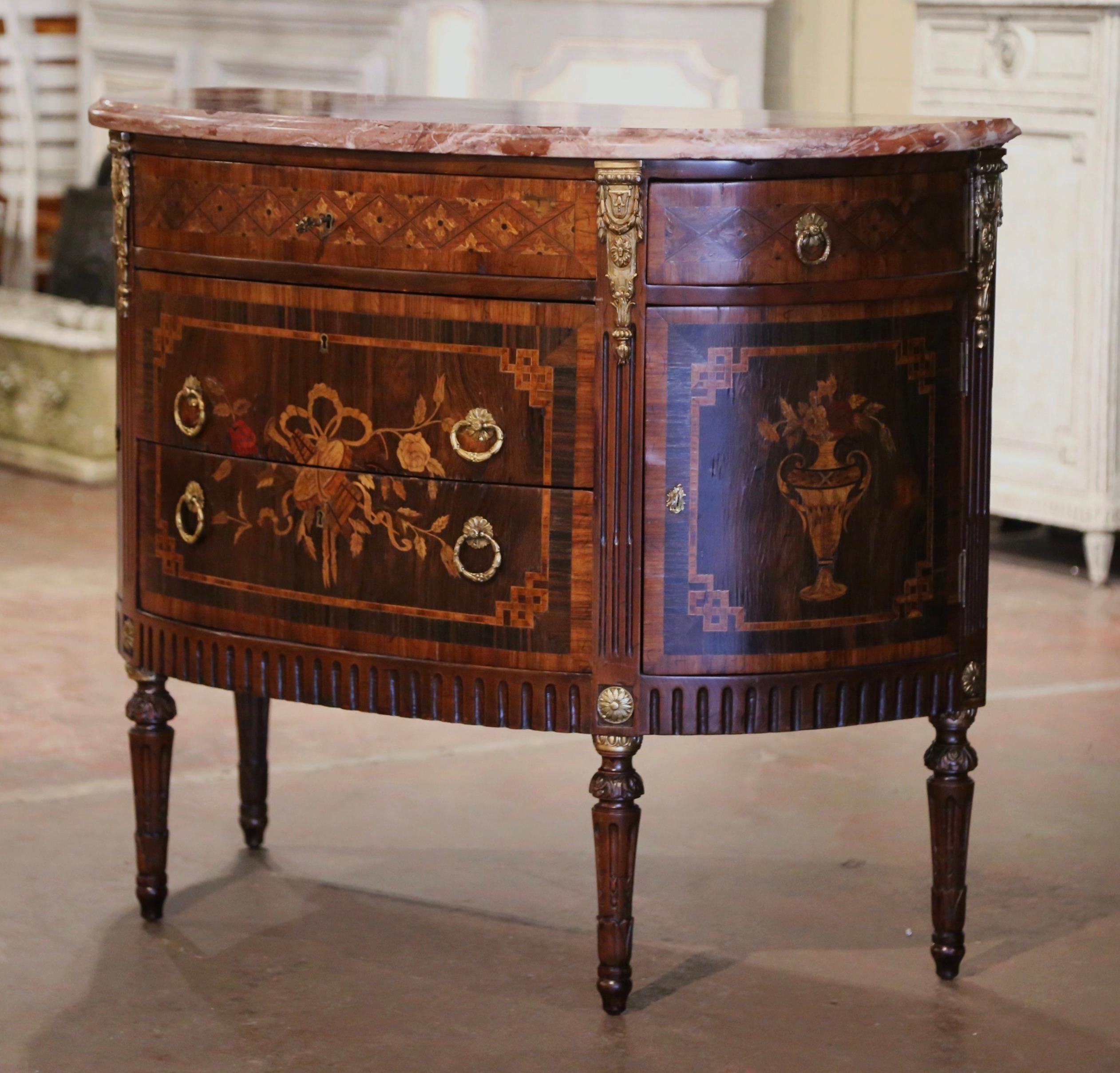 Invite Classic French elegance into your home with this Louis XVI style fruitwood bombe chest of drawers. Crafted in Paris, circa 1880 and built of mahogany wood with ormolu trim accents, the commode stands on fluted and tapered legs decorated with