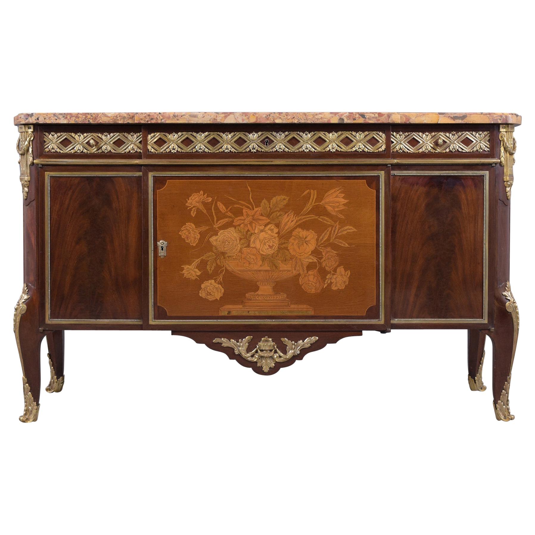 Discover the extraordinary allure of this 19th-century French Louis XVI buffet, meticulously hand-crafted out of mahogany wood and enhanced with bronze-mounted accents. Expertly restored by our team of craftsmen, this piece exudes an authentic charm