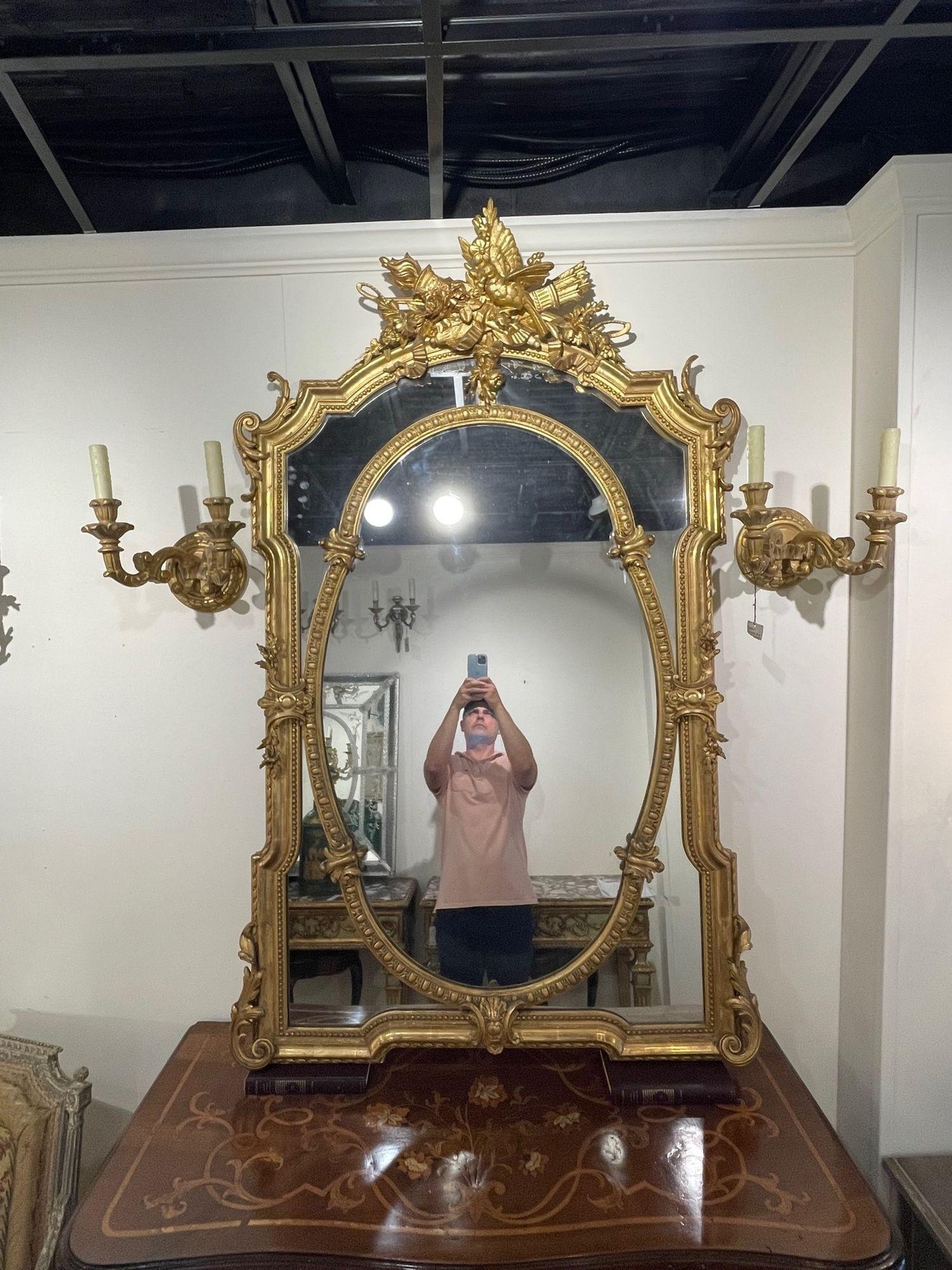 19th Century French carved and gilt-wood Louis XVI style mirror. Circa 1870. A fine addition to any home!