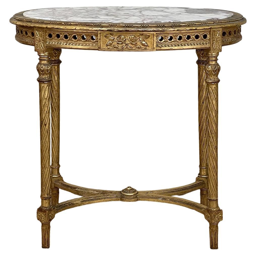 Table d'extrémité ovale néoclassique française Louis XVI du 19ème siècle en bois doré avec plateau en marbre