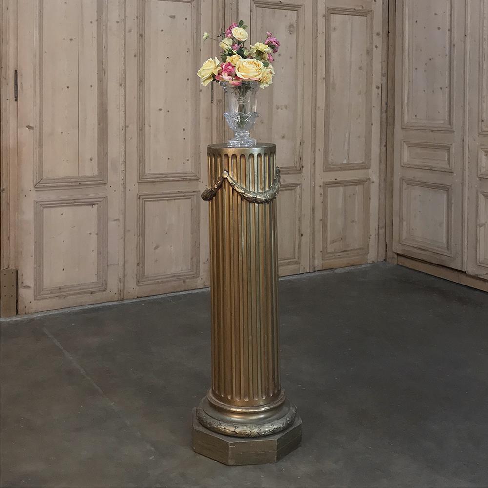 Hand carved from solid wood during the 19th century, then gilded to result in an opulent look, this 19th century French Louis XVI neoclassical giltwood pedestal is ideal for displaying your most treasured vase with fresh flowers, statuary, or other