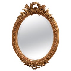 19th Century French Louis XVI Oval Carved Giltwood and Beveled Glass Mirror 19th Century French Louis XVI Oval Carved Giltwood and Beveled Glass Mirror