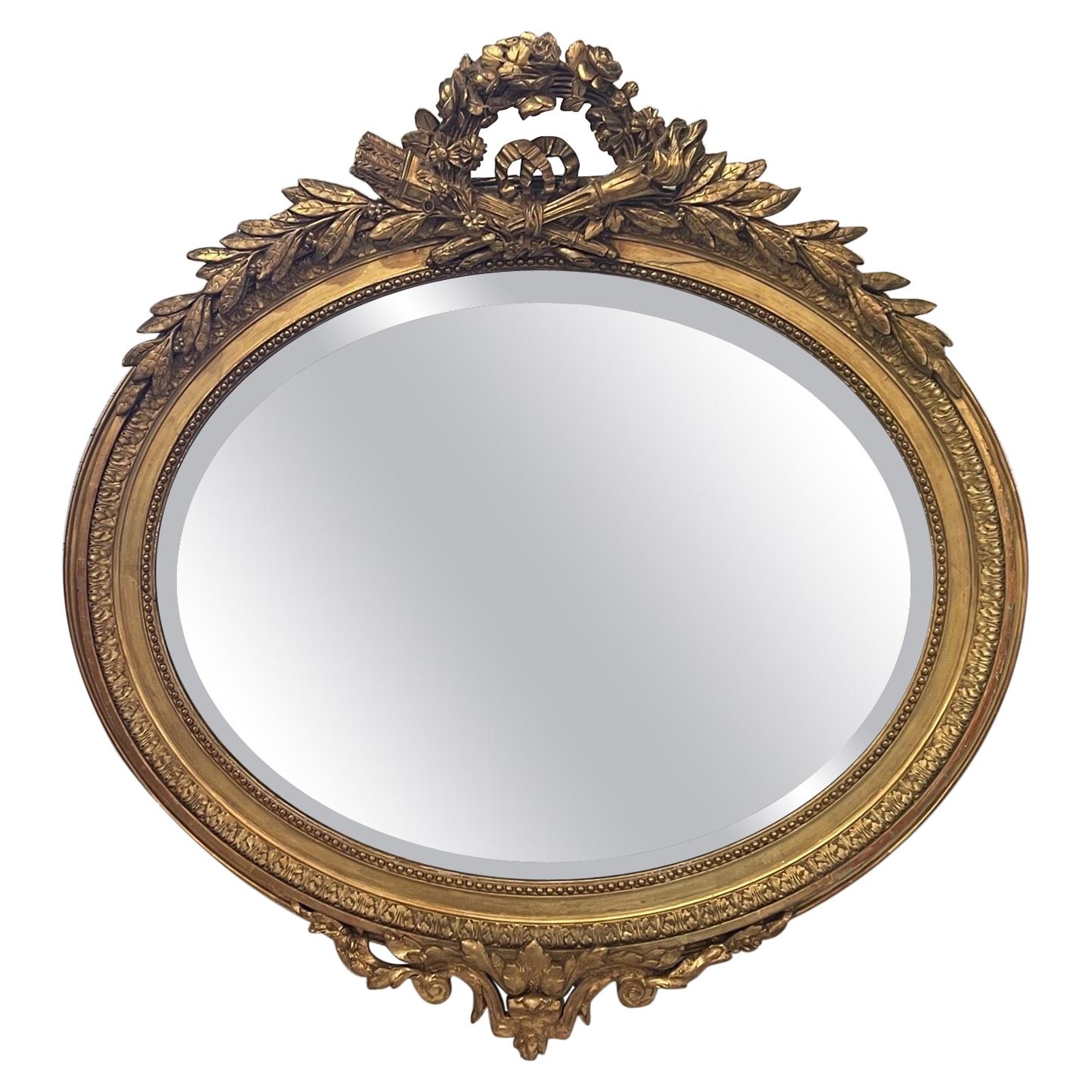 Miroir ovale français Louis XVI du XIXe siècle en bois doré en vente