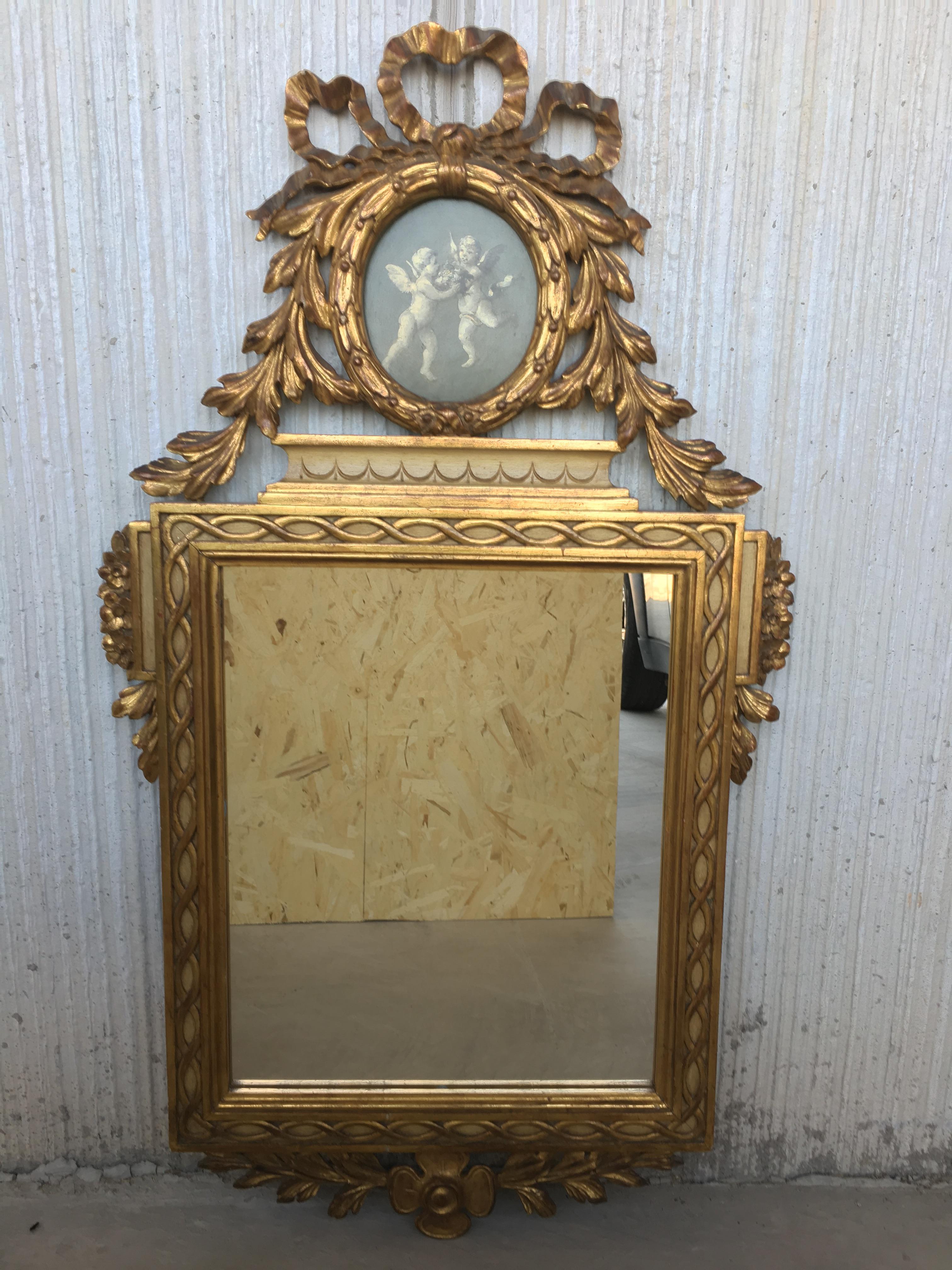 19th century, French, Louis XVI painted and gilt trumeau mirror depicting cherubs.