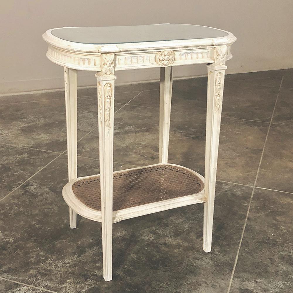 19th century French Louis XVI painted end table is ideal for any seating group, providing a glass topped surface for protection from daily use, and a patinaed painted finish that is slightly distressed to work so well with today's casual decors!