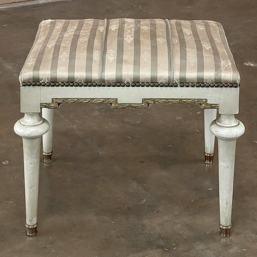 19th century French Louis XVI painted footstool ~ vanity bench represents a tailored expression of the Neoclassical Revival that for all practical purposes never really ended! handcrafted from seasoned fruitwood, it features four tailored, tapered