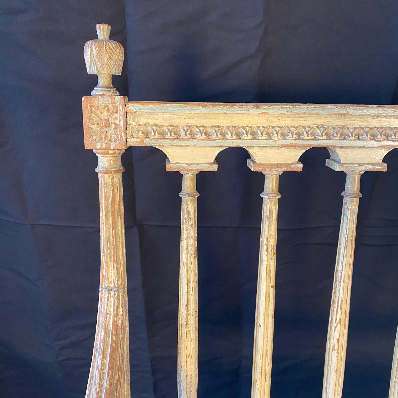 Stunning elegant and rare early 19th century Swedish Gustavian style loveseat, sofa or settee with exquisite carving and original paint. Frame with beautifully carved decor of acanthus leaves, florets and detailed scrolled moldings. Reeded rounded