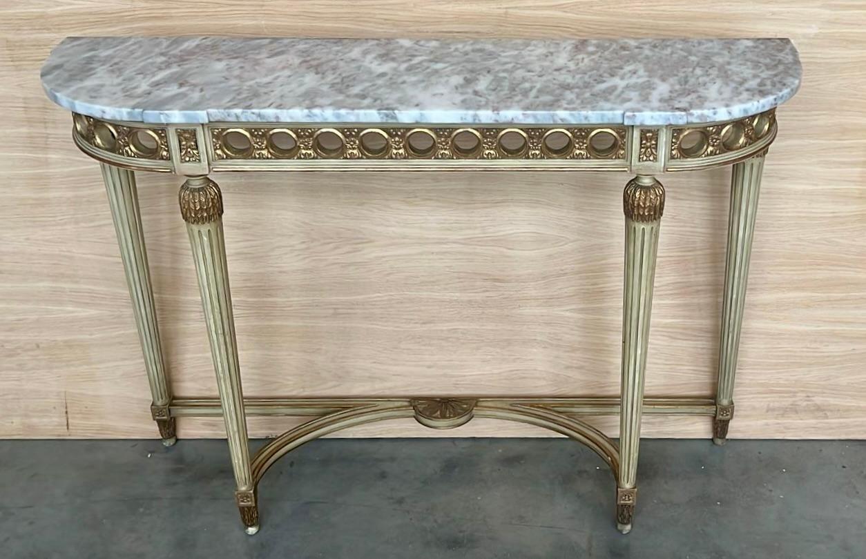 19th Century French Louis XVI painted marble top demilune console will make a beautiful accent for an entryway, hall or staircase! Resplendent with stunning architecture and embellishment that is the essence of the classical revival, it features bas