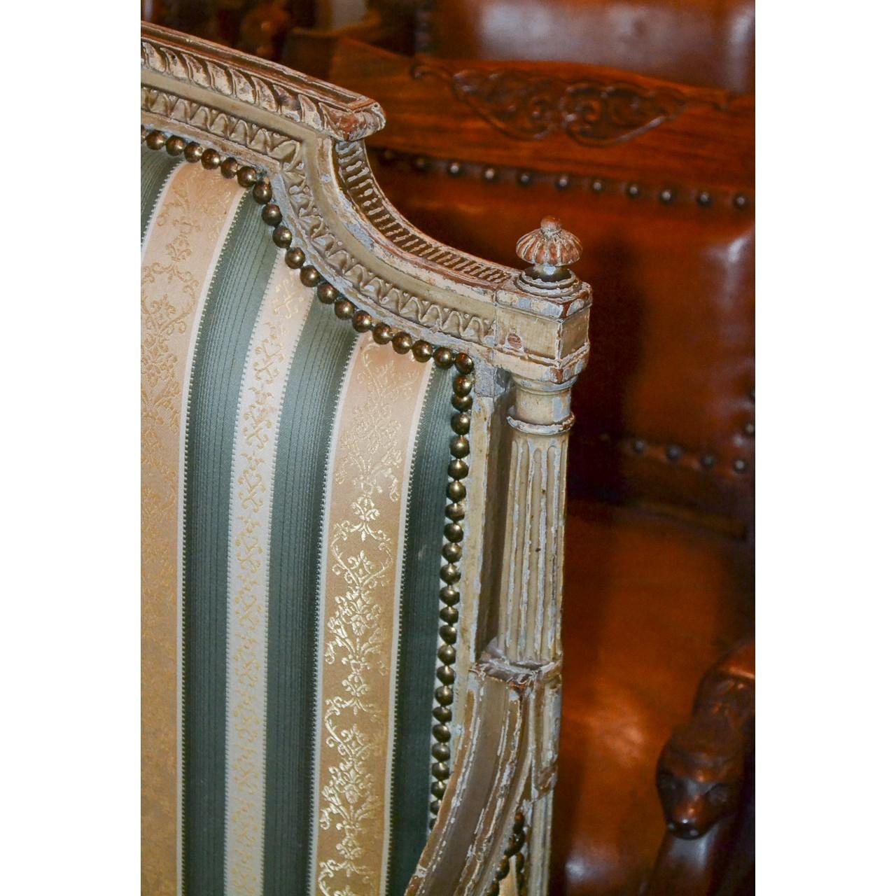 Stunning 19th century French Louis XVI style painted settee or sofa with a finely carved famed having a light gray patina. Beautiful striped damask upholstery and raised on classic tapered and fluted legs,

circa 1870.

Great focal piece!!