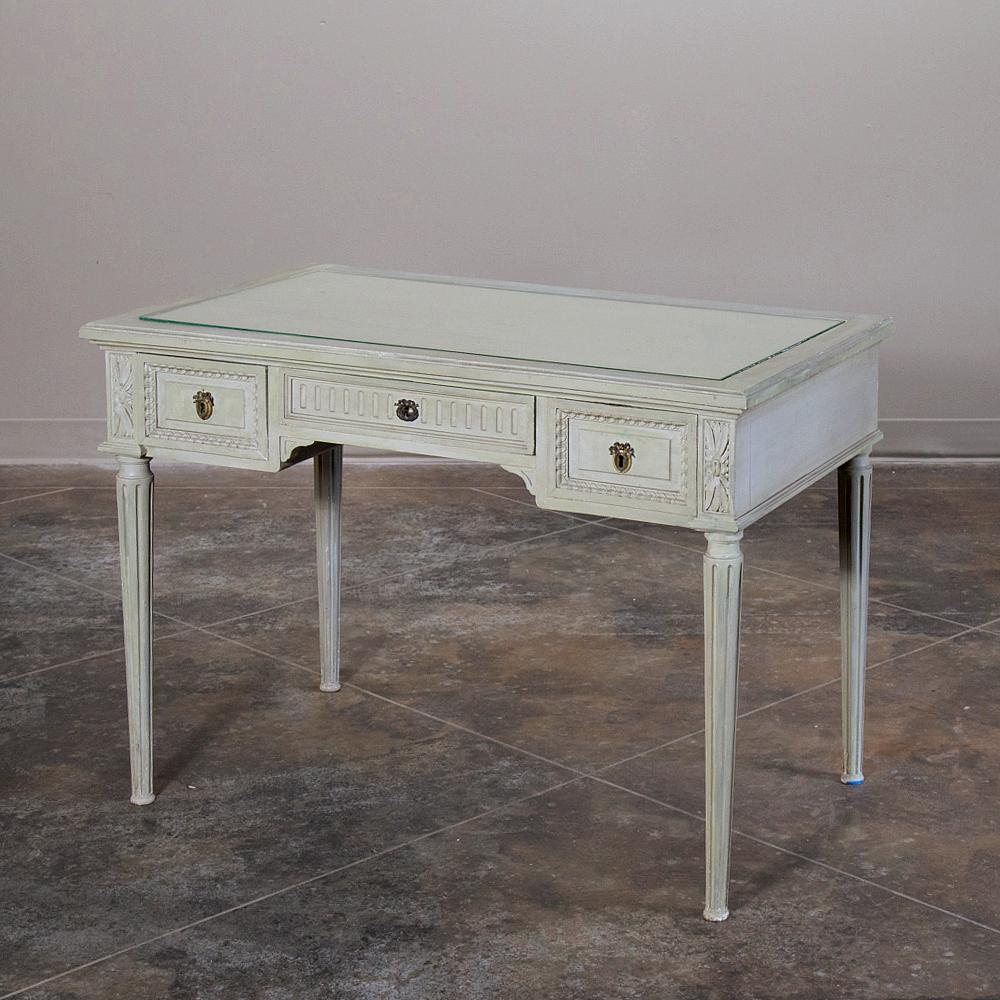 19th century French Louis XVI painted vanity, writing table can perform multiple tasks in style, with a tier of drawers under the fabric & glass top for functionality, and hand carved egg & dart, fluting and acanthus rosettes for decoration, all