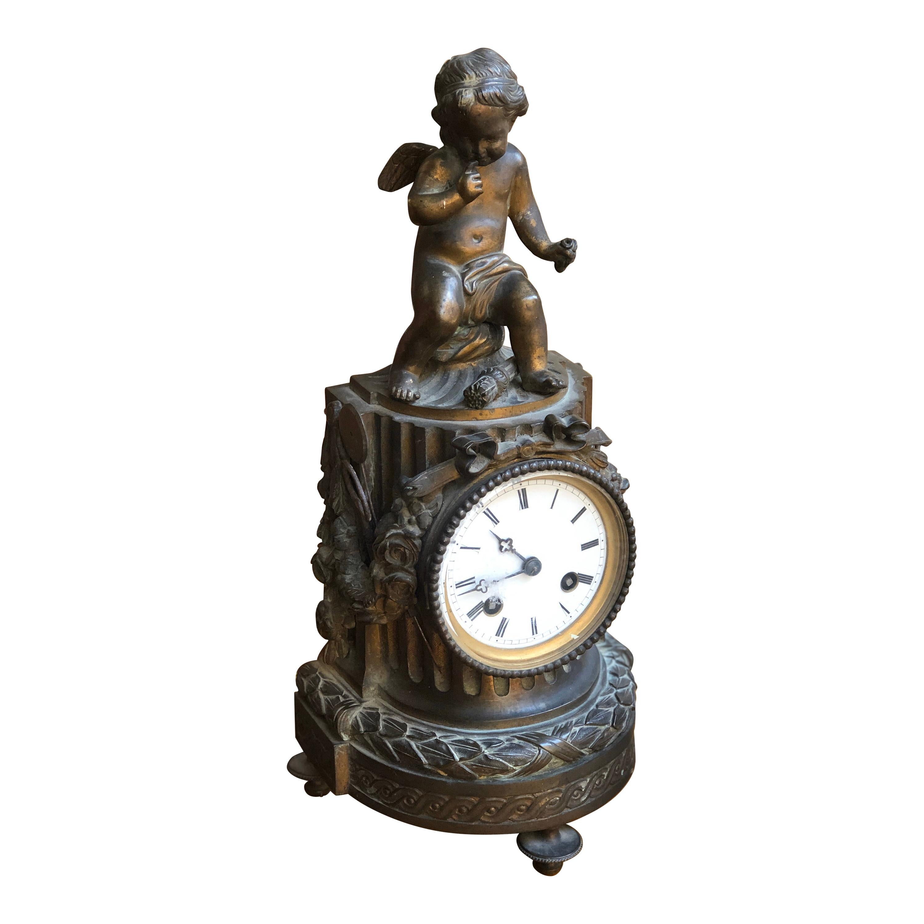 19th Century French Louis XVI Patinated Table Clock with a Figure of a Cupid