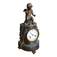 Antique 19th Century French Louis XVI Patinated Table Clock with a Figure of a Cupid