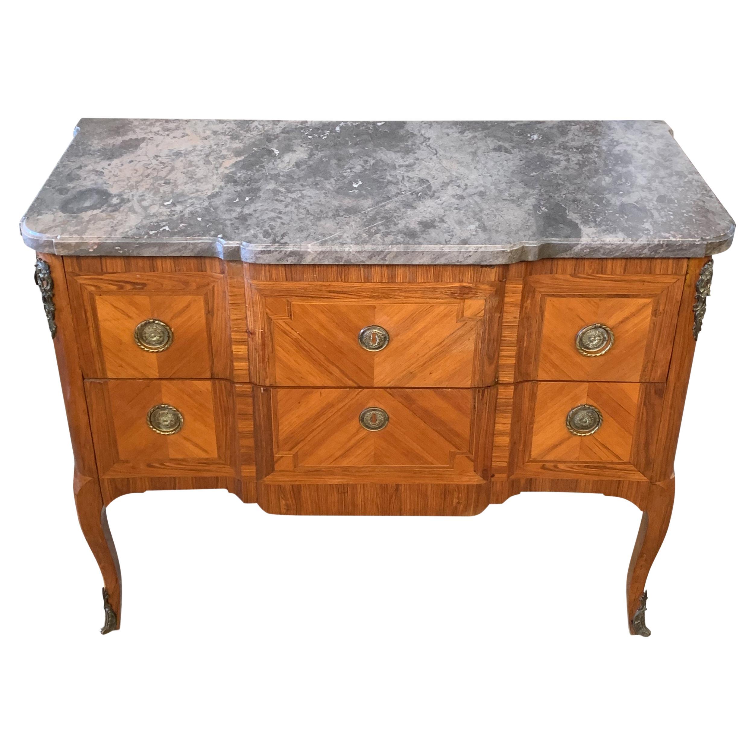 19th century French Louis XVI rosewood banded kingwood breakfront commode, with cabriole legs, finished with a grey marble top

Featuring two long drawers, with gilt metal decoration.

Previous owner was well travelled and this exquisite piece