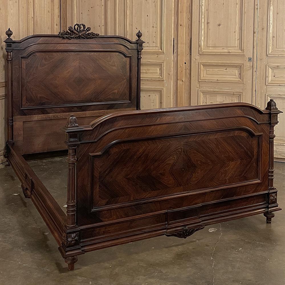 19th Century French Louis XVI Rosewood Queen Bed brings to life the neoclassical revival that occurred during the reign of Napoleon III.  Executed in exotic imported rosewood, it features veneers with oriented grain patterns to create intriguing