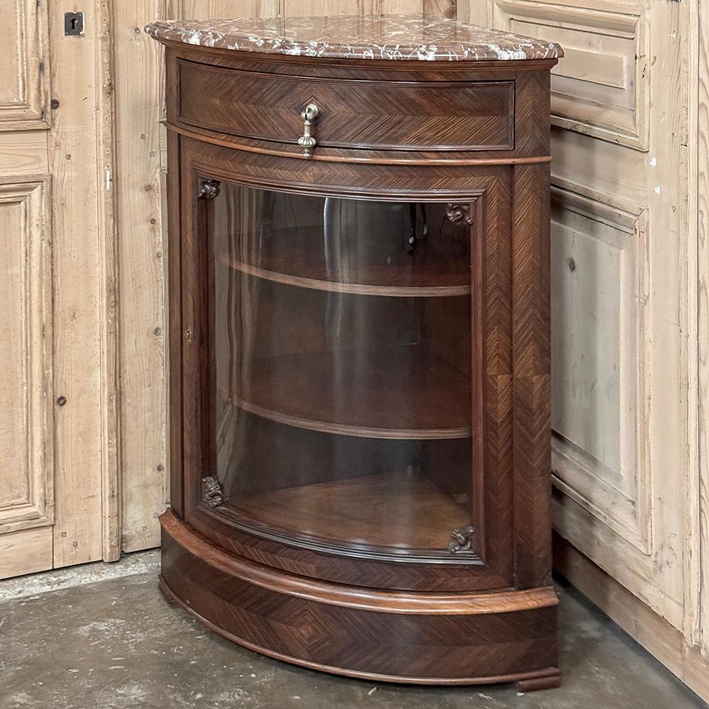 19th Century French Louis XVI Rosewood Marble Top Corner Vitrine ~ Cabinet is a remarkable piece, crafted with classic, tailored architecture but with distinctive features that set it apart.  Of course the shape is immediately evident, comprising a