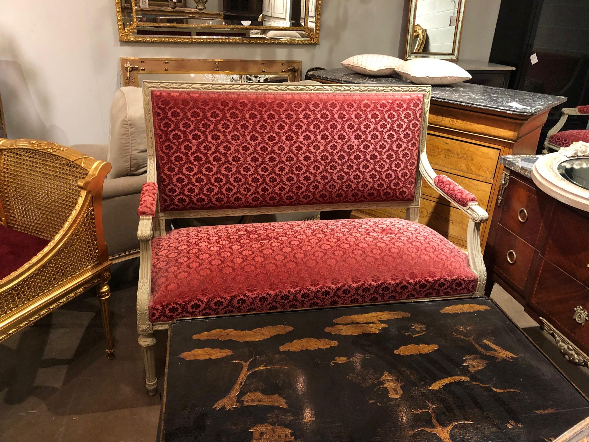 Lovely and elegant 19th century French Louis XVI style upholstered settee, hand-carved with painted finish,

circa 1880.