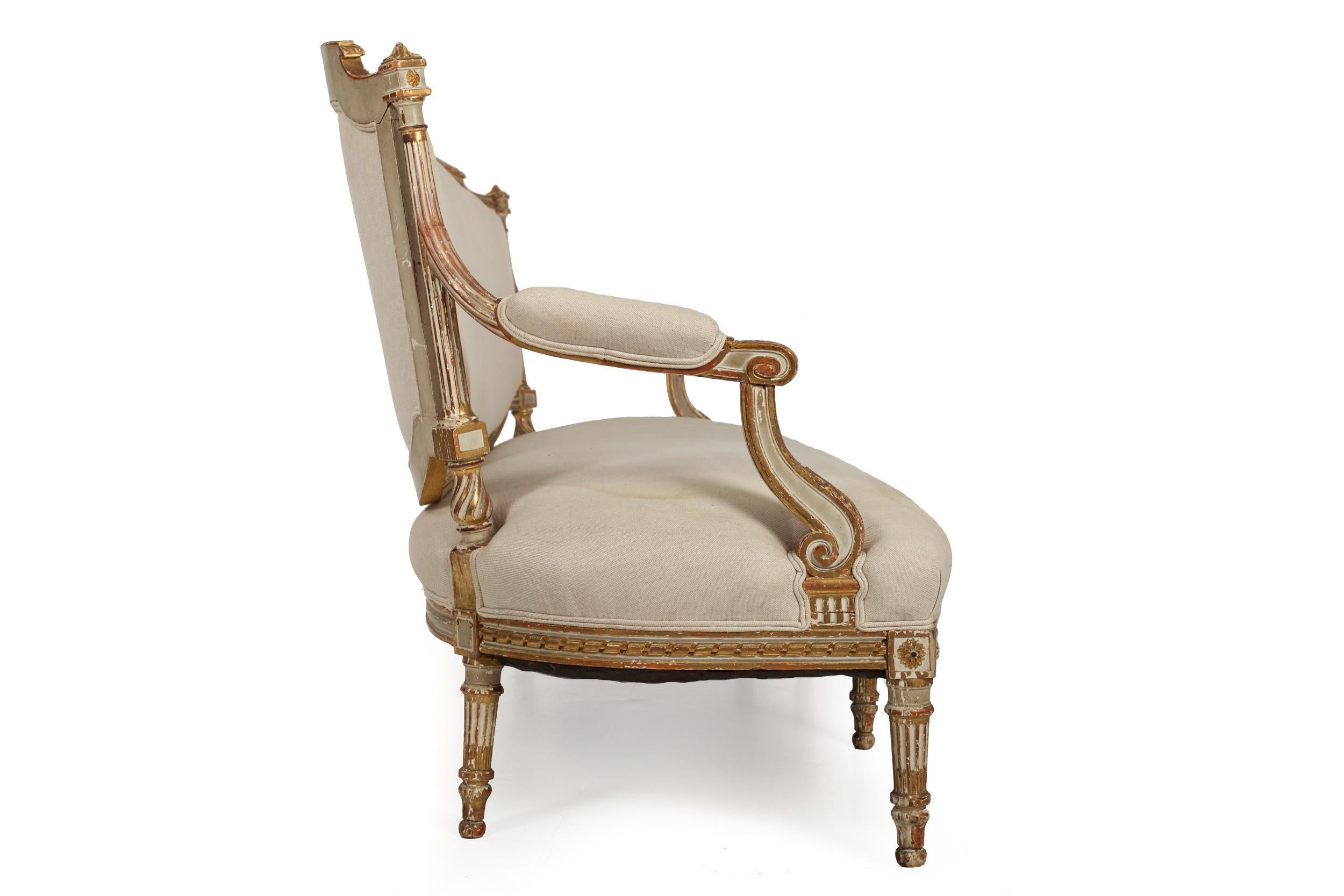 A good settee in the Louis XVI taste from the third-quarter of the nineteenth century, it exhibits an overall motif typical of the period: light angular acanthus foliage carvings, twisted-rope motifs surrounding both the seating and the seat-back,