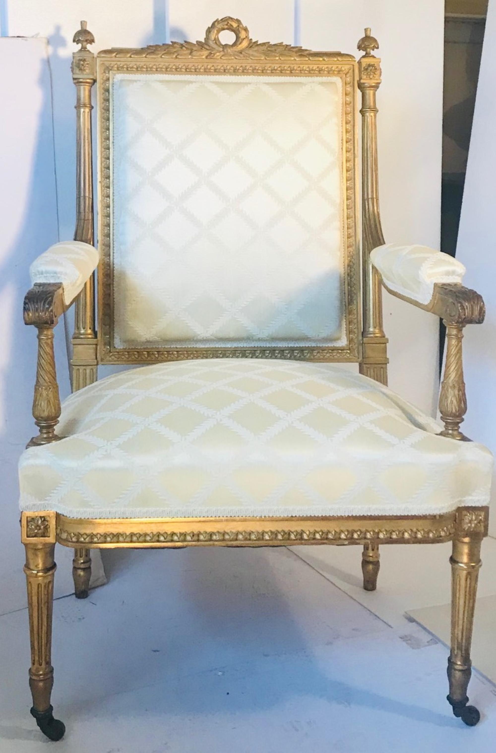 Antique French Louis XVI style armchair a la reine after Georges Jacob 19th century.

This beautiful Fauteuil is carved from walnut wood and gold leaf gilded. It is upholstered in champagne color silk damask. The tapered fluted straight legs are
