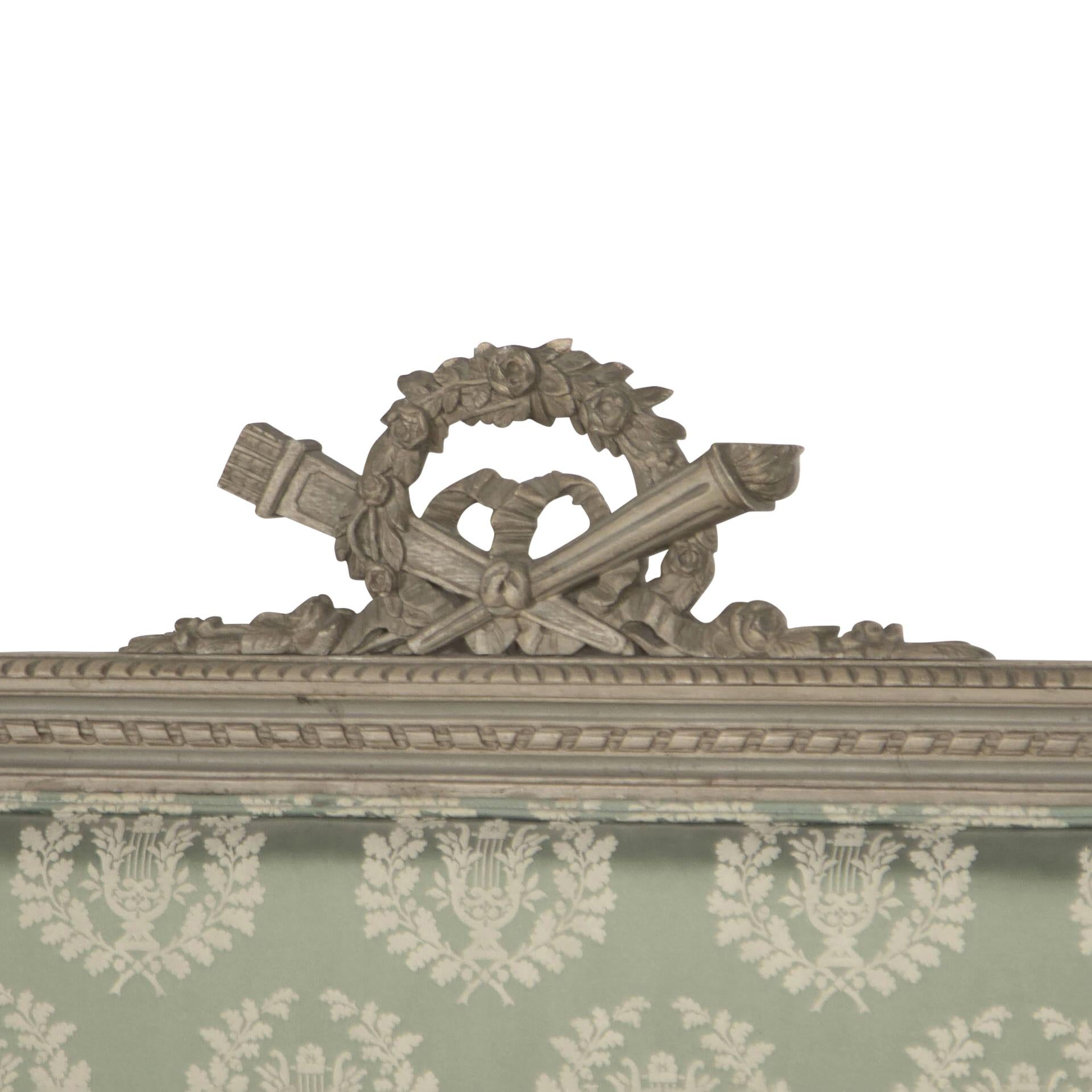 19th century French Louis 16th style bed, decorative carved design, painted, upholstered in vintage laurel wreath. 
Design fabric by Design Archive.