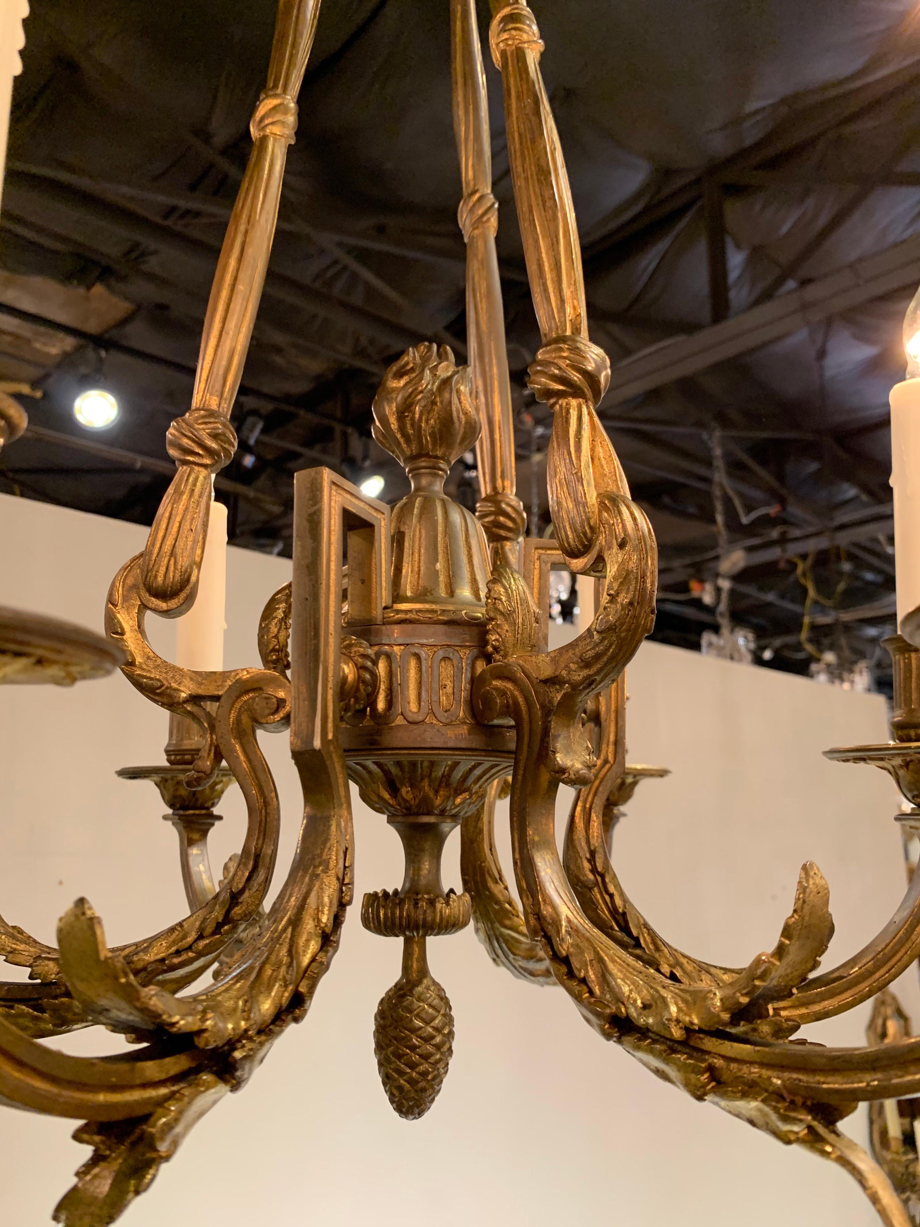 Very fine 19th century French Louis XVI style bronze chandelier with 6 lights. The arms of the chandelier are adorned with beautiful leaf patterns and there is also a pretty finial along with other decorative details. Makes an impressive statement!