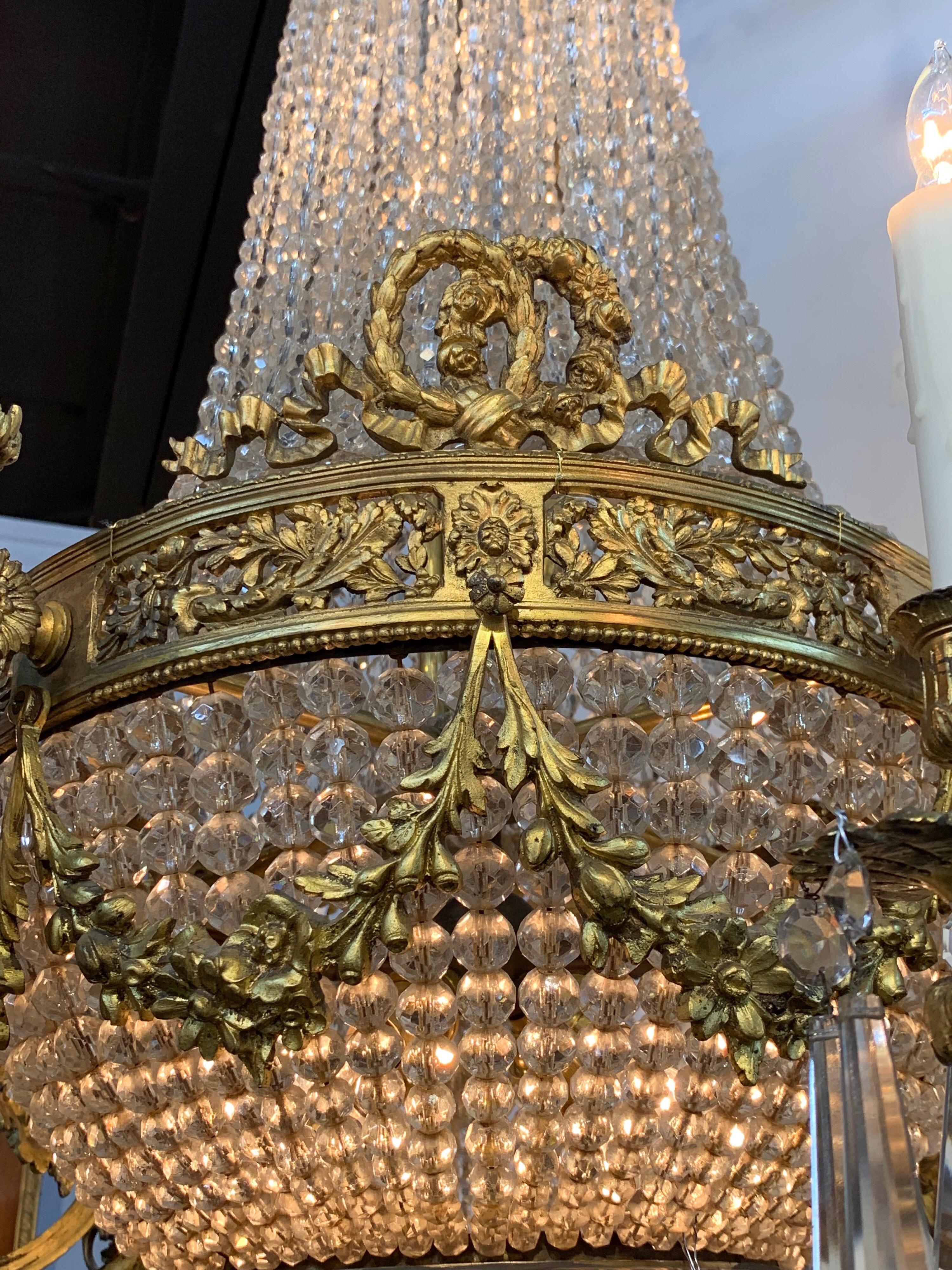 Stunning 19th century Louis XVI style bronze and crystal chandelier with 8 lights. Very finely cast bronze with good antique patina. Just re-wired and cleaned and ready to hang. Matching chain and canopy included.